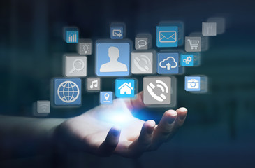 Icons connected to each other over businesswoman hand