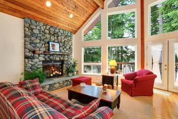 Open floor plan living room interior with rocks trim fireplace