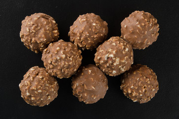 chocolate ball or chocolate bonbon on a background.