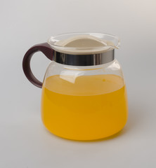 Orange juice in jar on a background.