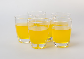 Orange juice in glasses on white background.