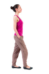 back view of walking  curly woman.  backside view of person.  Rear view people collection. Isolated over white background. dark-skinned girl is smiling and looking up.