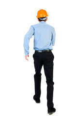 Back view of running engineer in helmet. Walking guy in motion. Rear view people collection. Backside view of person. Isolated over white background. Businessman in a blue shirt and a helmet in an
