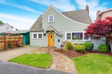 Classic American house exterior with nice landscape desing.