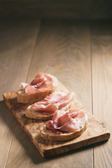 simple ciabatta slices with speck ham