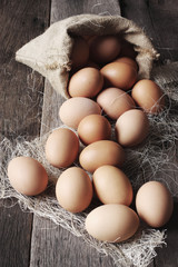 Eggs on wooden background