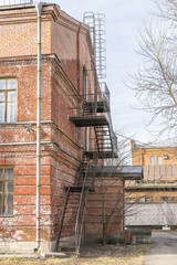 Old brick building with iron stairs