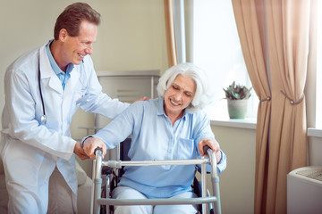 Young doctor helping female patient