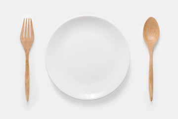 Design concept of mockup white dish, wood spoon and wood fork se