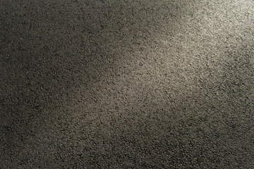 Hintergrund nasser Asphalt im seitlichen Gegenlicht  -  Background wet asphalt in lateral Backlight