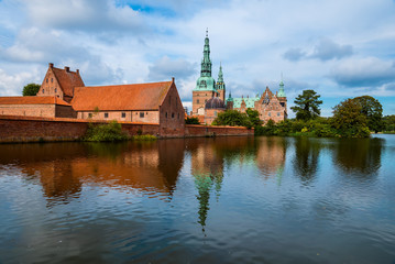 Fototapeta premium Frederiksborg castle reflected in the lake in Hillerod, Denmark. Renaissance castle and romantic lake near Copenhagen.