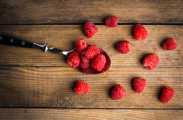 Raspberry on the rustic wooden table