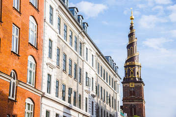 Church of Our Saviour spire and scandinavian houses in Copenhagen, Denmark