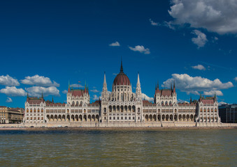 Fototapeta premium The famous Hungarian Parliament in Hungary with blue sky and clouds