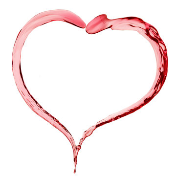 red liquid in shape of heart on white background