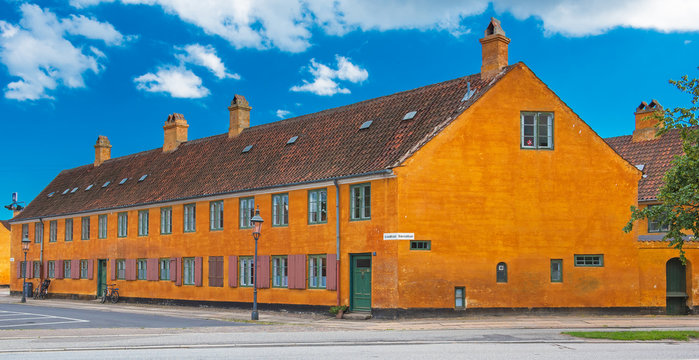 Nice old yellow houses of Nyboder, medieval district of Copenhagen, Denmark