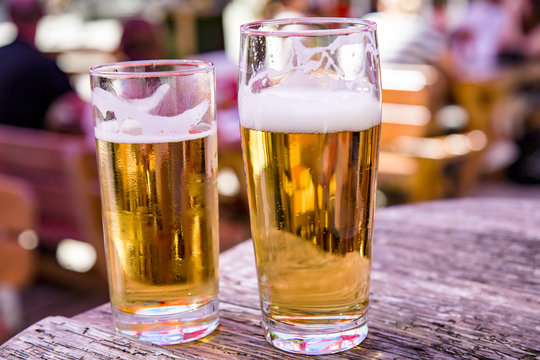 Beer glasses with beer on the table in the beer garden