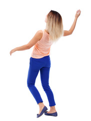 Balancing young woman.  or dodge falling woman. Rear view people collection.  backside view of person.  Isolated over white background. The blonde in a pink t-shirt dodges.