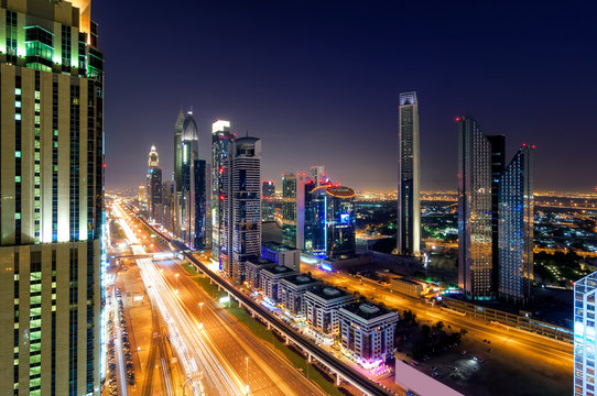 Amazing night dubai downtown skyline with tallest skyscrapers and traffic jam during rush hour, Dubai, United Arab Emirates