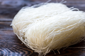Rice noodles on rustic wooden table