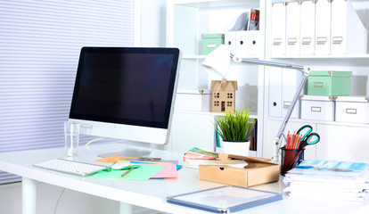 Fototapeta na wymiar Designer working desk with computer and paperwork