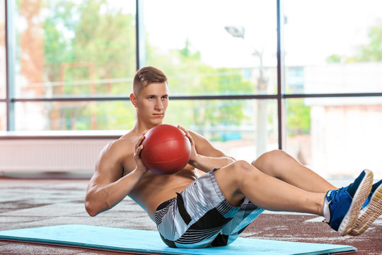 athletic muscular guy doing exercise