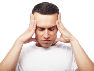 Attractive young man suffering of strong headache