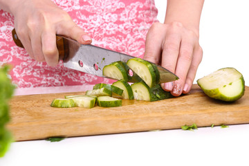 Healthy food concept. Cutting vegetables into a salad.