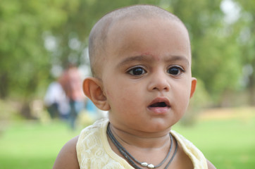 Cute Baby Portrait , Siting At The Garden 