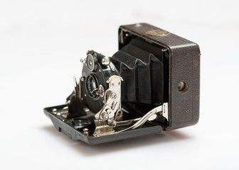The retro photo camera close up isolated
