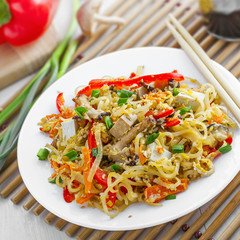 Traditional Asian meal made of rice noodles, vegetables, tofu and shiitake mushroom. Oriental cuisine food.