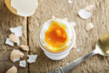 Perfect soft boiled egg for delicious breakfast on a table. Traditional homemade food. Top view.
