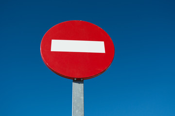No entry sign on blue sky background