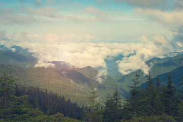 Clouds floating among the mountains