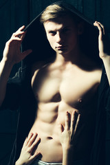 Obraz premium Male torso with female hands