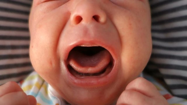 Mouth of crying newborn baby, audio, close-up