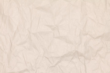 Obraz premium Recycled crumpled light brown paper texture or paper background for design with copy space for text or image.