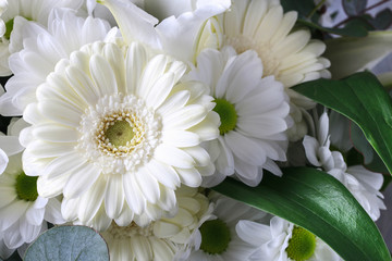 Floral background with white gerbera flowers, chrysanthemums and