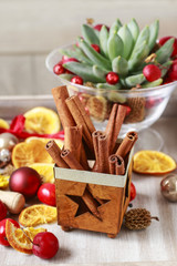 Christmas decorations - cinnamon sticks, dried fruits and balls.