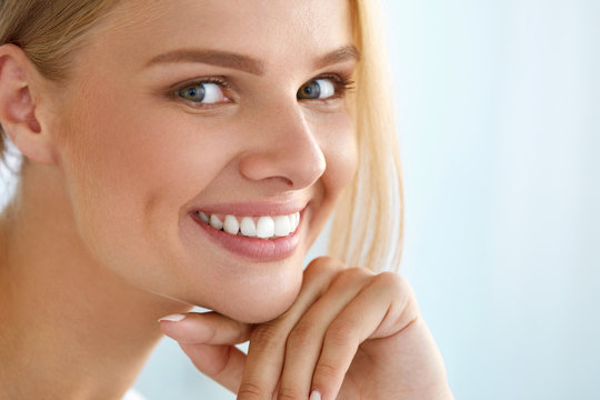 Beauty Portrait Of Woman With Beautiful Smile Fresh Face Smiling. High Resolution Image