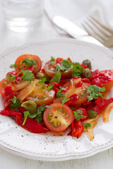 salad with tomato, red pepper and capers on plate