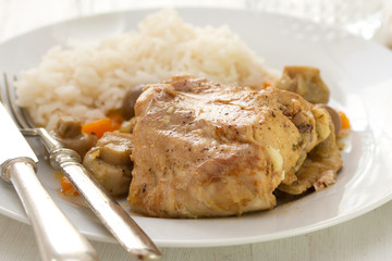 fried rabbit with boiled rice on white dish
