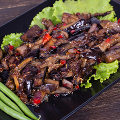 Baked eggplant with onions, garlic, red hot chili pepper and walnuts