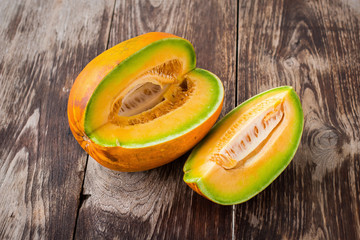 honeydew melon on a wooden table background