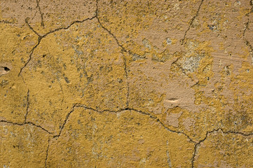 Obraz premium Plastered walls with peeling paint yellow