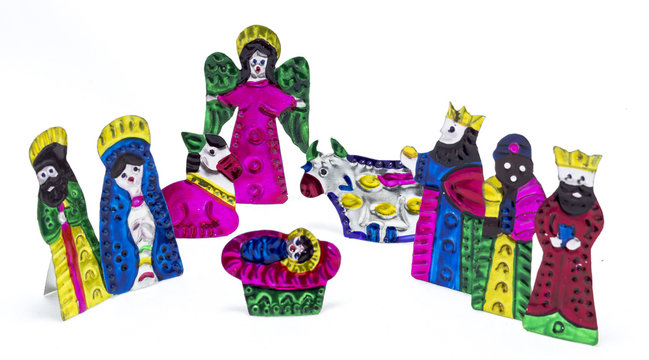 colorful nativity scene made of painted and cut metal pieces, mexican