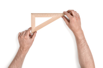 Man holding a wooden set square