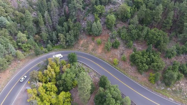 Aerial shot of traffic on a mountain road switchback