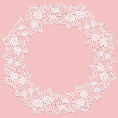 Template with white lace frame for card or invitation. Circular ornament of openwork flowers on a pink background.