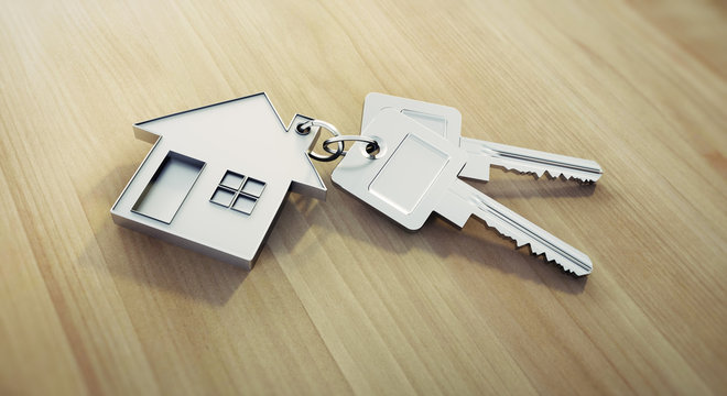 Haus-Schl&uuml;ssel auf hellem Holz